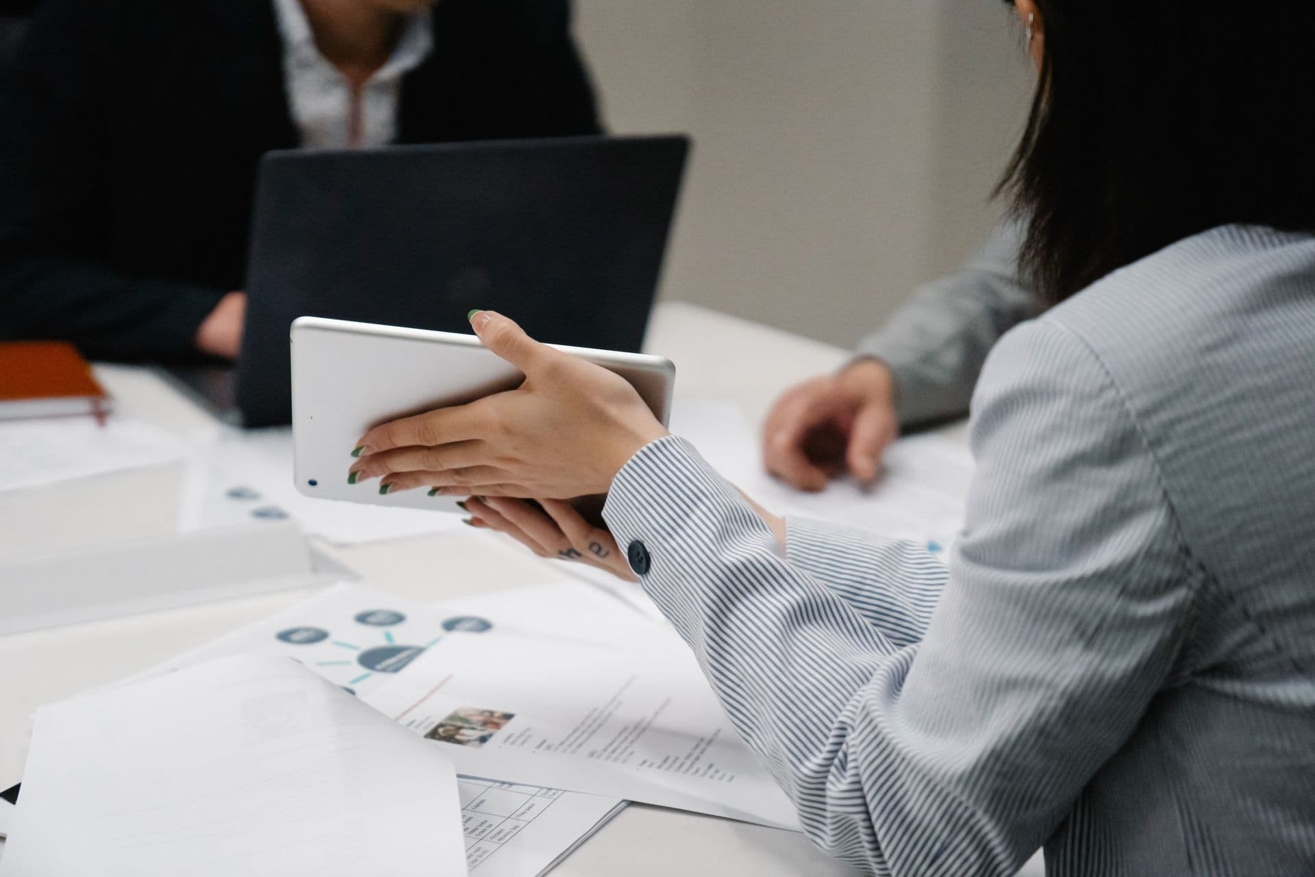 Consultants reviewing network diagrams during a strategy meeting