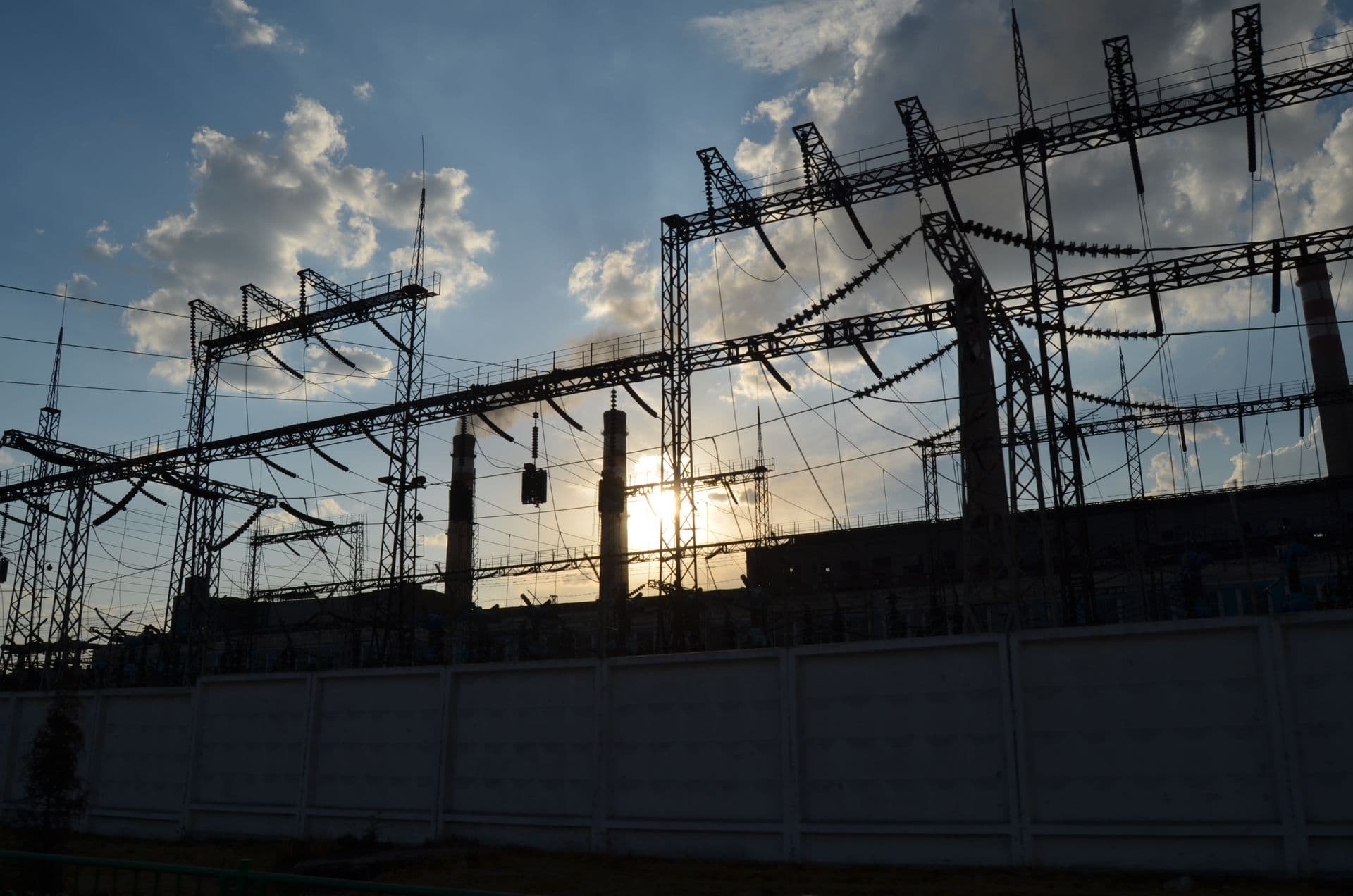 Electrical utility substation silhouetted at dusk